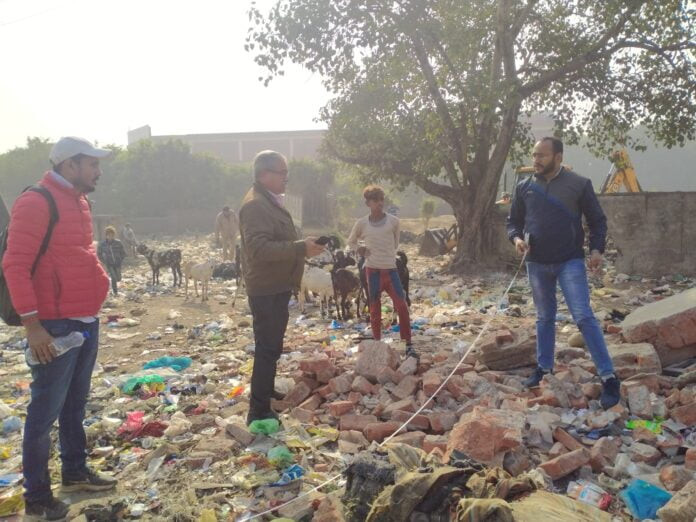 Railway officials inspect land