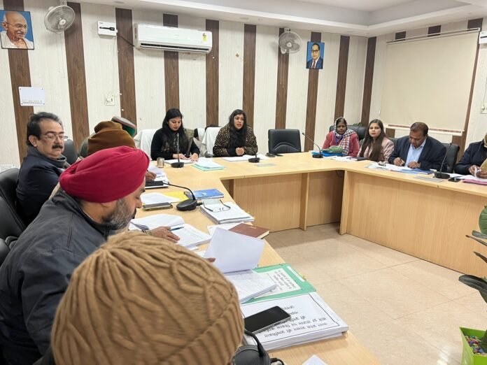 District Magistrate meeting with officials