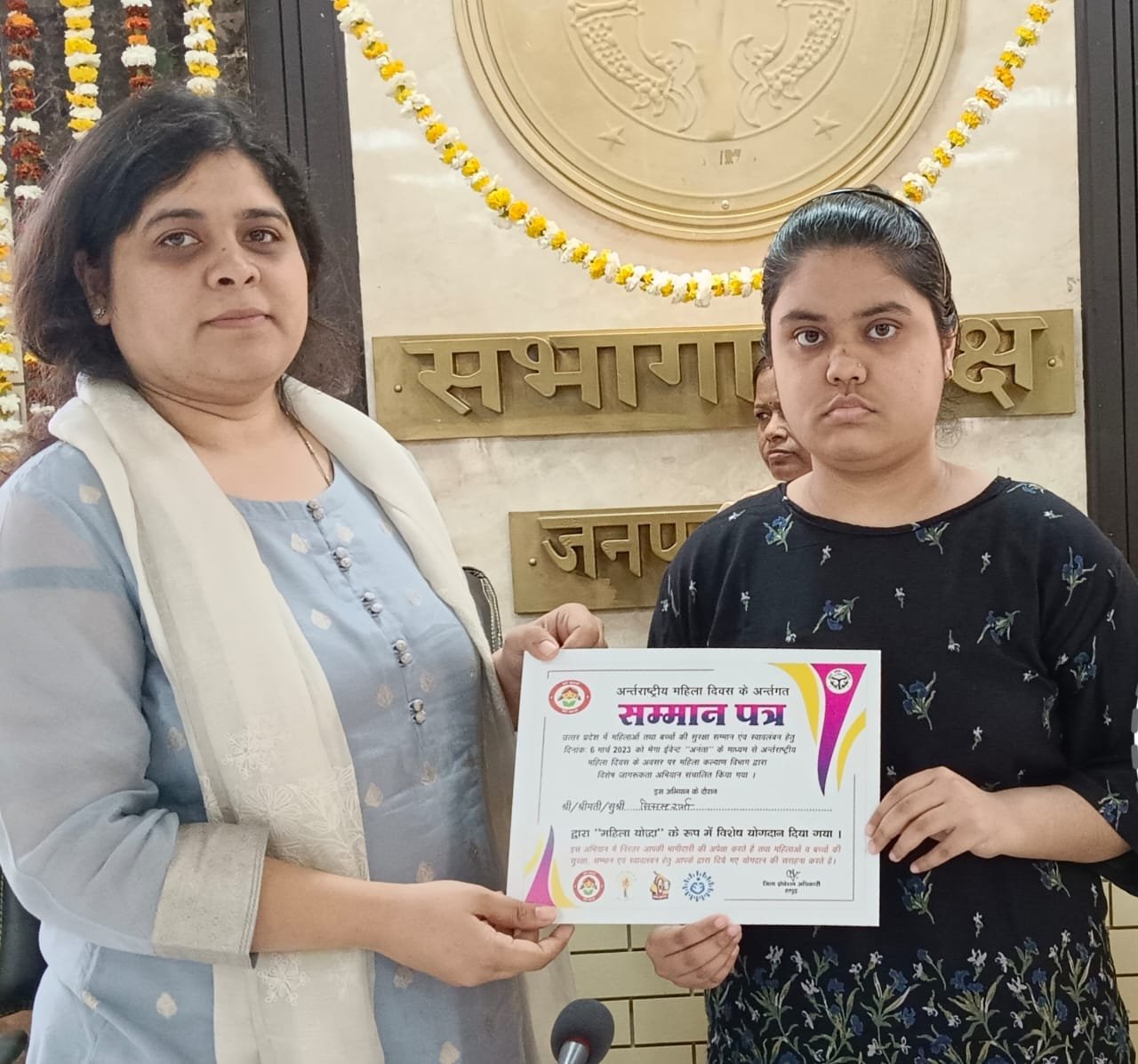 District Magistrate giving certificate