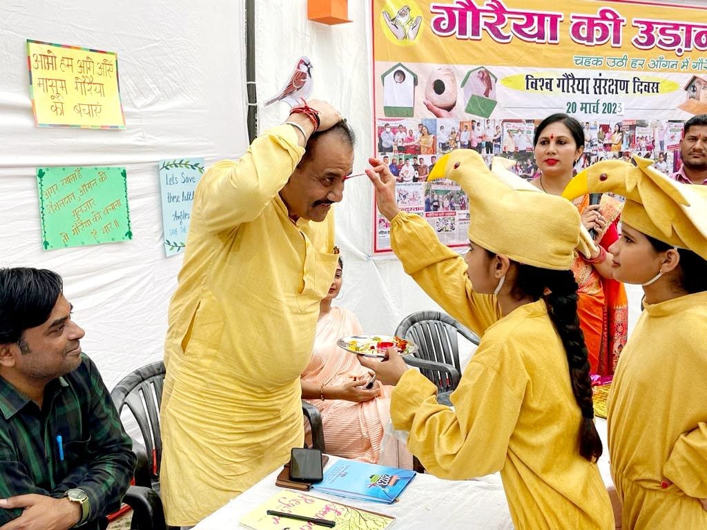 Welcoming the program by applying Tilak