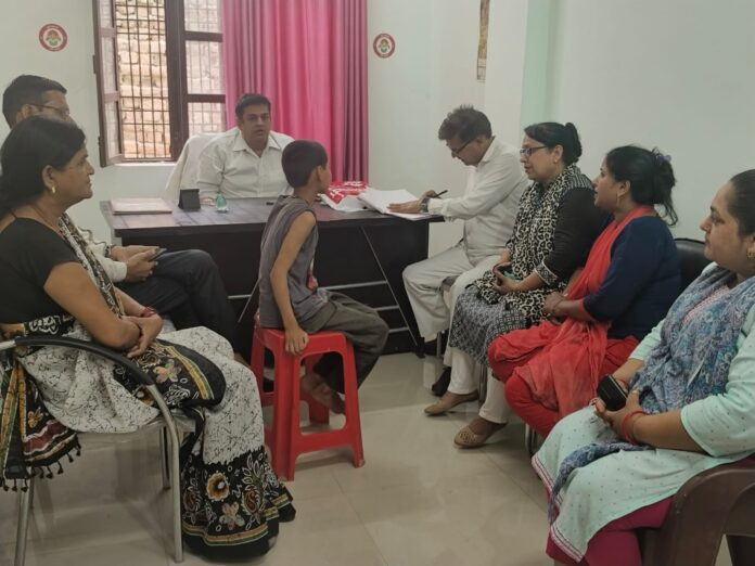 Child welfare committee team talking to the child