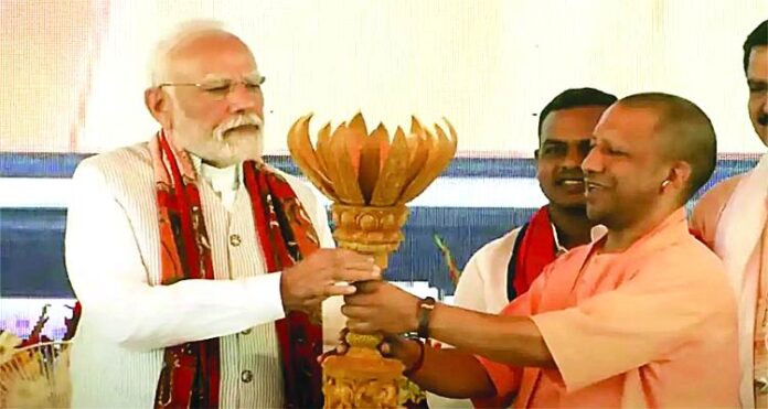 CM Yogi Gift PM Modi